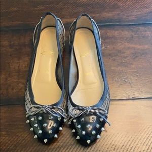 Christian Louboutin black studded lace flats.